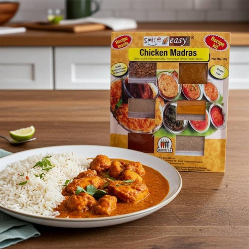 SpicenEasy chicken madras recipe kit packaging showing spice sachets and rich red curry
