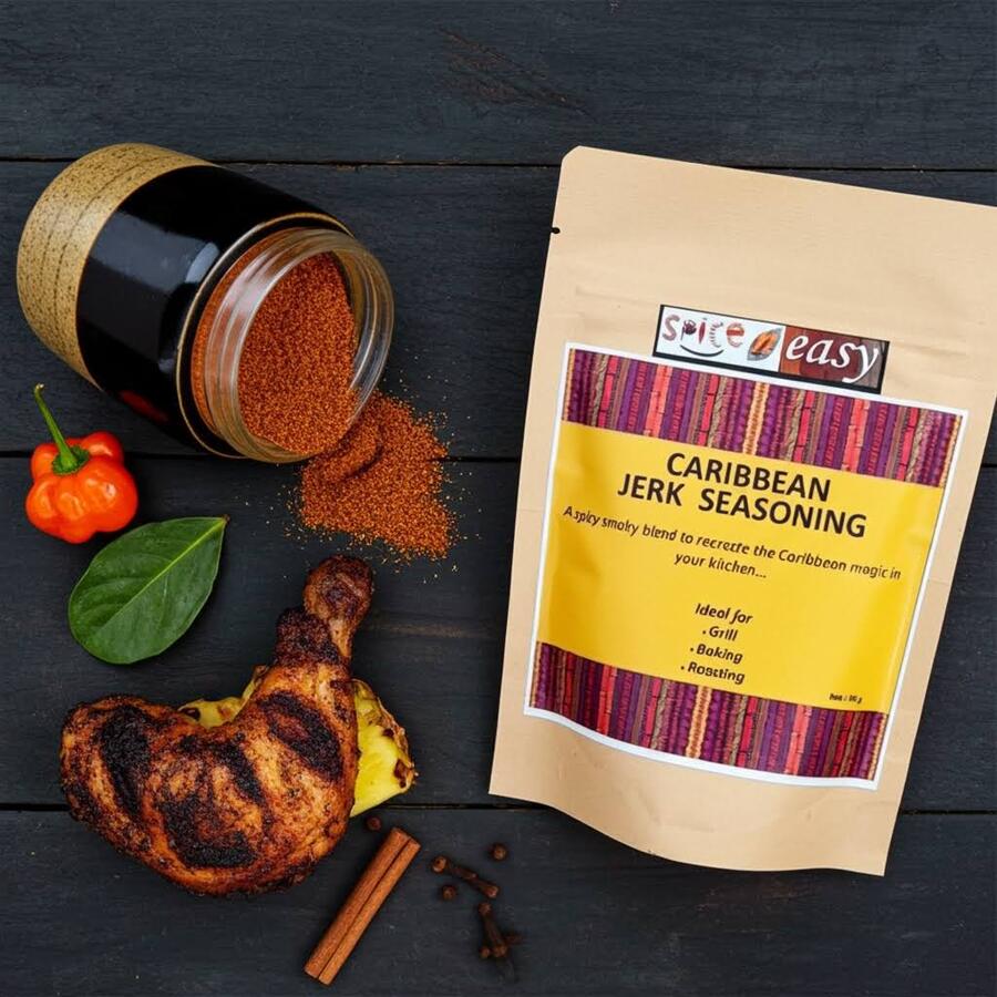 Spice n Easy Caribbean Jerk seasoning pouch standing upright on a dark surface