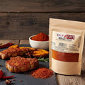 Spice n Easy Magic Dust seasoning pouch standing upright on a dark surface