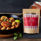 Spice n Easy Taco seasoning pouch beside filled tacos with toppings