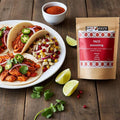 Spice n Easy Taco seasoning pouch standing upright on a dark surface